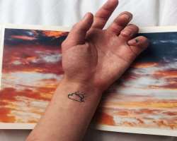 He has a cloud tattoo on his wrist.